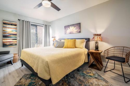 a bedroom with a bed and a chair and a window at DreamWest Sedona Getaway - 3 Bdrm 2 Ba - Sleeps 6 in Sedona