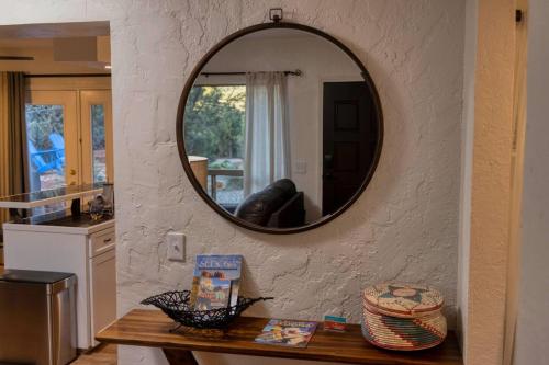 a mirror on a wall in a kitchen with a table at Peaceful Desert Hideaway in Sedona