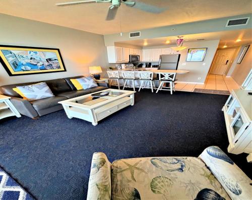 a living room with a couch and a table at Wyndham Ocean Walk Resort Daytona Beach 1605 - 16th Floor 1 BR Resort Condo Direct Oceanfront in Daytona Beach