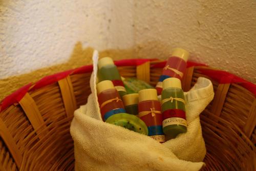 a basket filled with lots of different colored candles at Hotel Bahía de la Luna in Arroyo Cruz