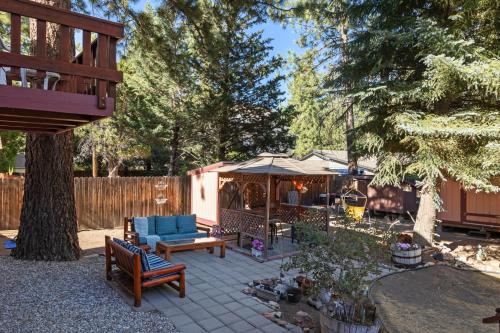 a backyard with a patio with a gazebo at Mountain Retreat Woodburning Fireplace Games in Big Bear City