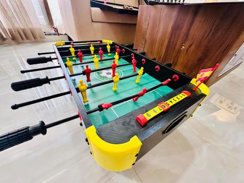 a ping pong table with miniature people on it at Katha Villa 63 - Luxury Holiday Home in Karjat