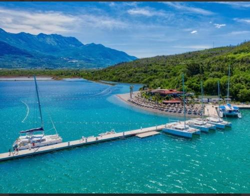 a group of boats docked at a dock in the water at Apartments Dream in Tivat