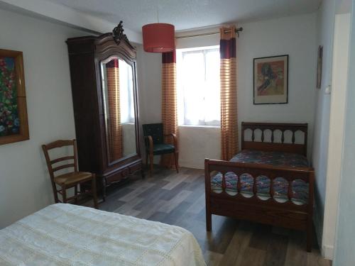 Posteľ alebo postele v izbe v ubytovaní la petite maison d'Albert
