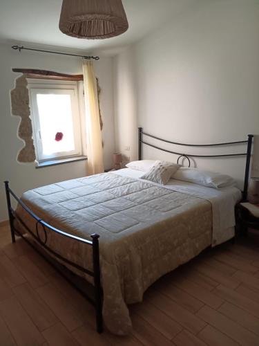 A bed or beds in a room at Alloggio Turistico Civico 4