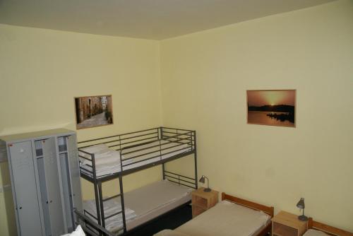 a bedroom with two bunk beds in a room at Happy Go Lucky Hotel + Hostel in Berlin