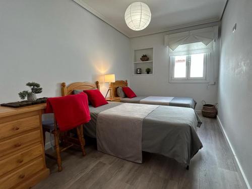 a bedroom with a bed and a desk and a bed at Baiona Curuxa in Baiona