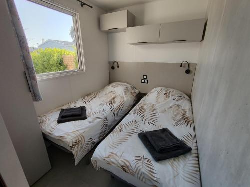 Postel nebo postele na pokoji v ubytování Mobile home à Mimizan géré par un particulier