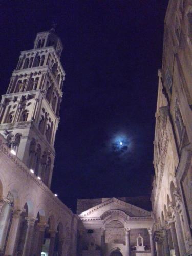 a large building with a clock tower at night at Apartment Zoky in Split
