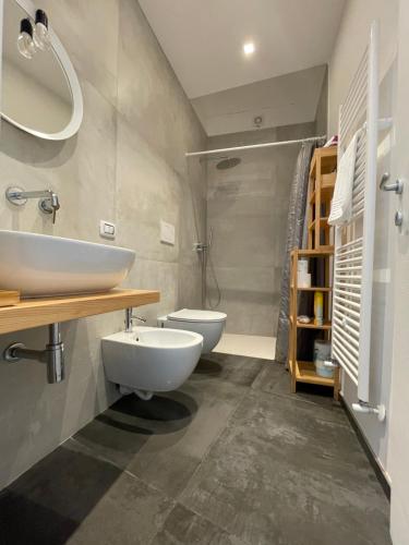 a bathroom with a sink and a toilet in it at Casa Luna 23 in Monopoli