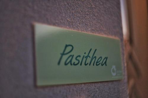 a sign on a wall with the word resistance at Three Charites Resort in Gialova