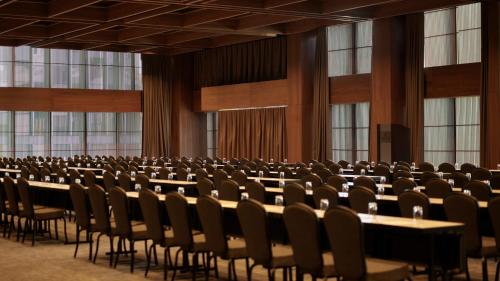 a large room with rows of tables and chairs at Presidente InterContinental Monterrey by IHG in Monterrey