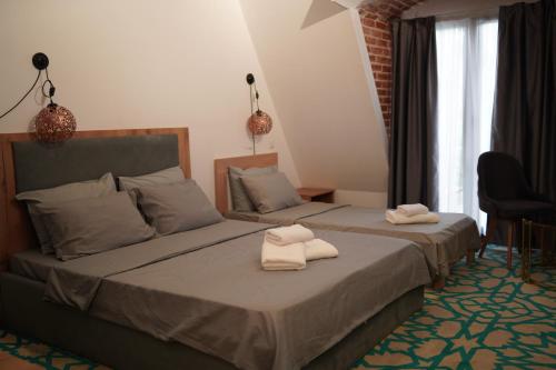 Una cama o camas en una habitación de Skopje Horizon Hotel