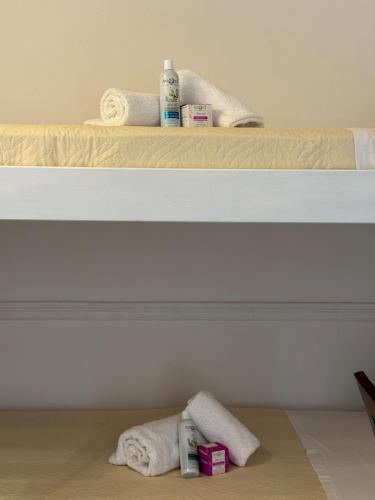 two bunk beds with towels on the floor at Vistas Venecianas Corfu in Corfu