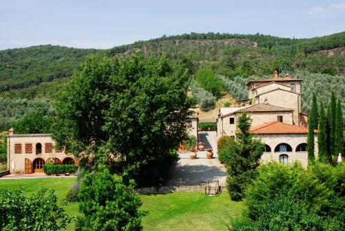 an estate in the hills with a large building at Tenuta Lupinari in Bucine