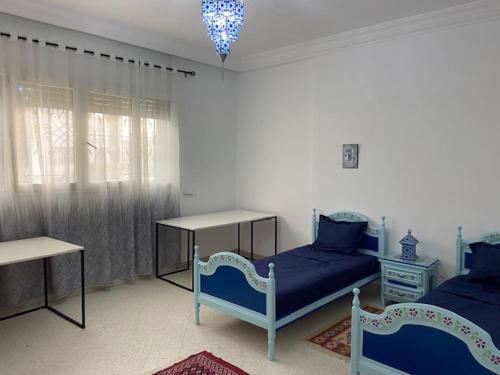 Postel nebo postele na pokoji v ubytování Marsa-Sidi Bousaid Pleasant Authentic Home