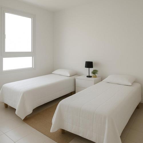 Ένα ή περισσότερα κρεβάτια σε δωμάτιο στο Departamento familiar en pleno centro.