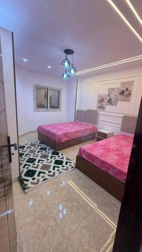 Llit o llits en una habitació de صبحه هاوس