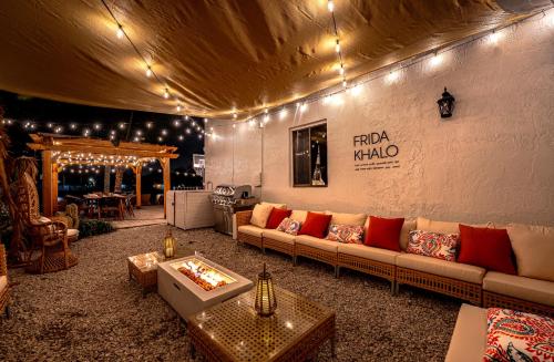 a living room with a couch and a table at Waterfront Villa with Beach, Game Room, Cinema and Spa in Pembroke Pines