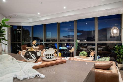 a living room with a view of the city at Indulgence at Meriton, Spectacular Views, Sleeps 6 Includes Carpark in Brisbane