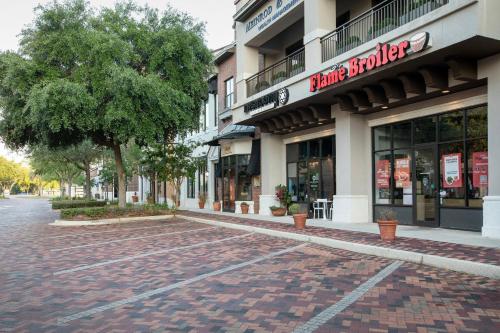 an empty street in front of a building at Hotel Indigo Jacksonville-Deerwood Park by IHG in Jacksonville