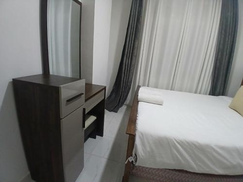 Ένα ή περισσότερα κρεβάτια σε δωμάτιο στο Residence Next Door Gz