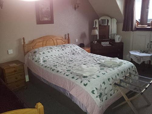 A bed or beds in a room at Norlaggan 