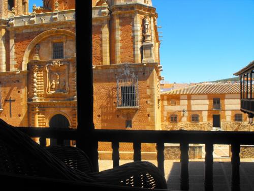 a view of a building from a balcony at Hospedería Santa Elena in San Carlos del Valle