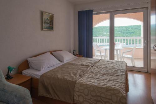 Katil atau katil-katil dalam bilik di Apartments Obradović