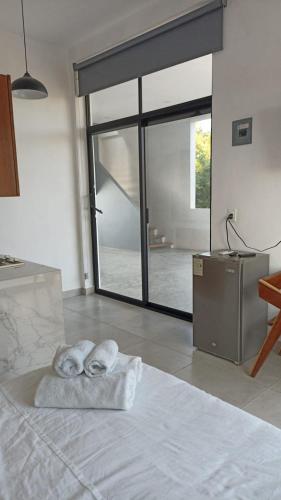 Ein Bett oder Betten in einem Zimmer der Unterkunft Edificio Regam