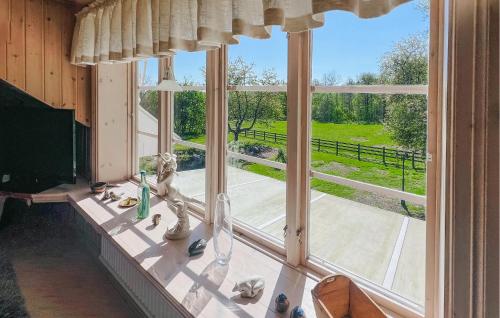a room with a large window with a view at Awesome Home In Skövde With Sauna in Skövde