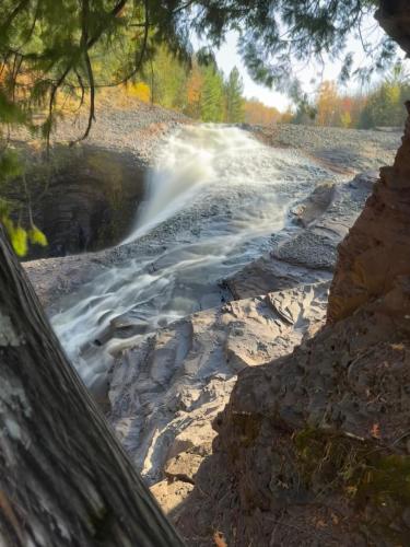 a view of a waterfall in a river at Snow Otter Haus in Bessemer