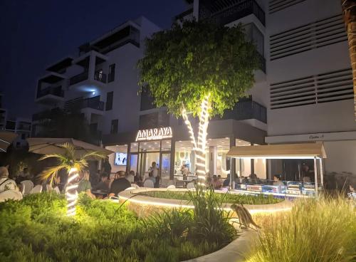 a rendering of a hotel at night at Appartement luxueux - Piscines, Plage 300m, Résidence fermée in Martil