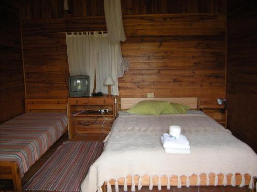 Tempat tidur dalam kamar di Camping / Appartment Coimbrao