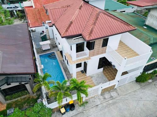 an aerial view of a house with a red roof at 4 bedroom with big pool villa near clark in Sampong