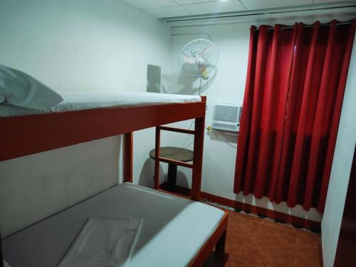 Cama o camas de una habitación en Stay Malate (Wanderers Guest House)
