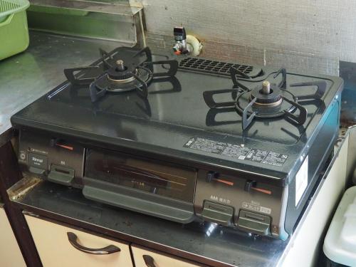 a stove top oven sitting in a kitchen at Karadake Hills in Hanno