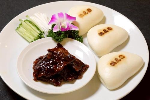 a plate of food with meat and potatoes and broccoli at Cityroute Hotel in Osaka