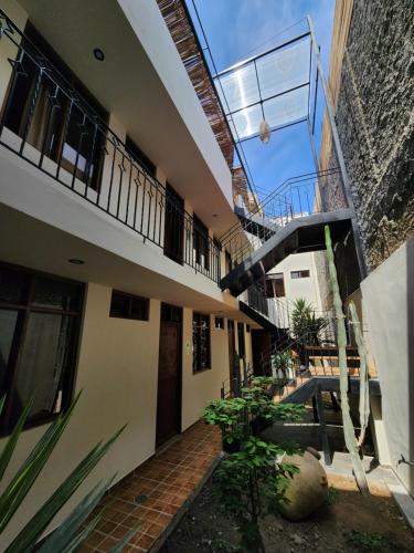 an external view of a building with a balcony at China Chancay Hotel in Chancay