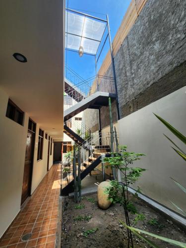 an external view of a house with a staircase at China Chancay Hotel in Chancay