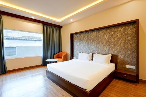 Postel nebo postele na pokoji v ubytování Hotel Tark Plaza Near IGI Airport Delhi