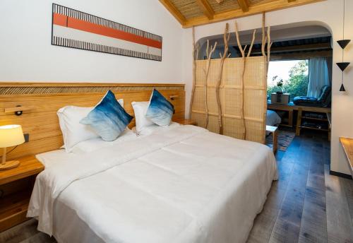 Huaqi Country House B&Bにあるベッド