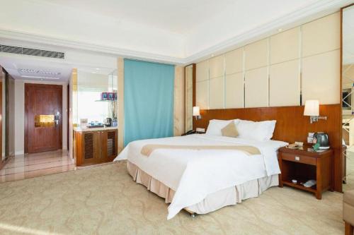 Postel nebo postele na pokoji v ubytování Regency Hotel