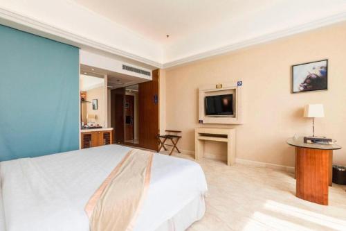 Postel nebo postele na pokoji v ubytování Regency Hotel