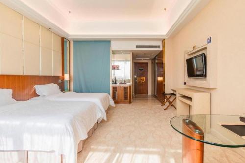 Postel nebo postele na pokoji v ubytování Regency Hotel