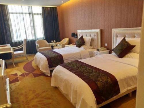 Ένα ή περισσότερα κρεβάτια σε δωμάτιο στο Metropark Hotel