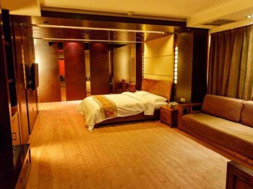 Ένα ή περισσότερα κρεβάτια σε δωμάτιο στο Metropark Hotel