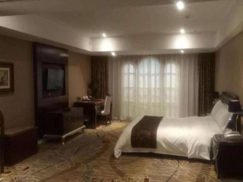 Ένα ή περισσότερα κρεβάτια σε δωμάτιο στο Metropark Hotel