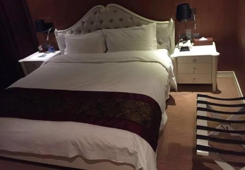 Ένα ή περισσότερα κρεβάτια σε δωμάτιο στο Metropark Hotel