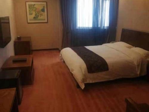 Ένα ή περισσότερα κρεβάτια σε δωμάτιο στο Metropark Hotel